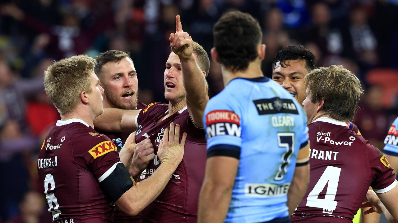 Nathan Cleary looks on at a group of Queenslanders. Pics Adam Head