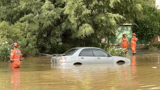 A car is submerged in water after the main burst in Willow Drive, Paradise. Picture: Bianca De Marchi