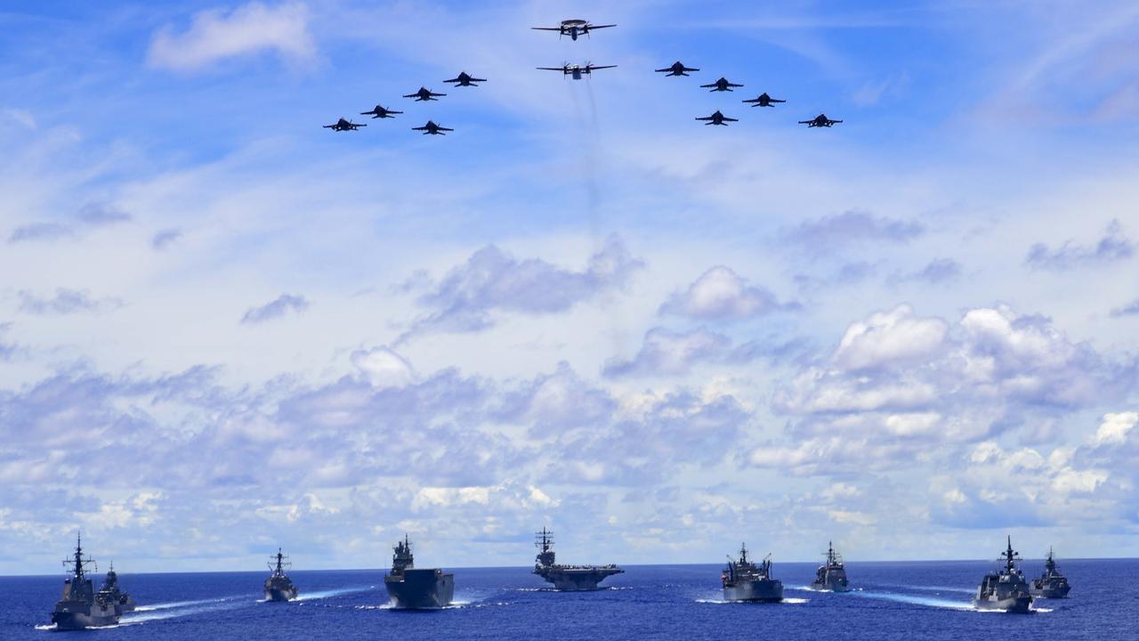 Australian, US and Japanese navy ships taking part in a trilateral passage in the Philippine Sea.