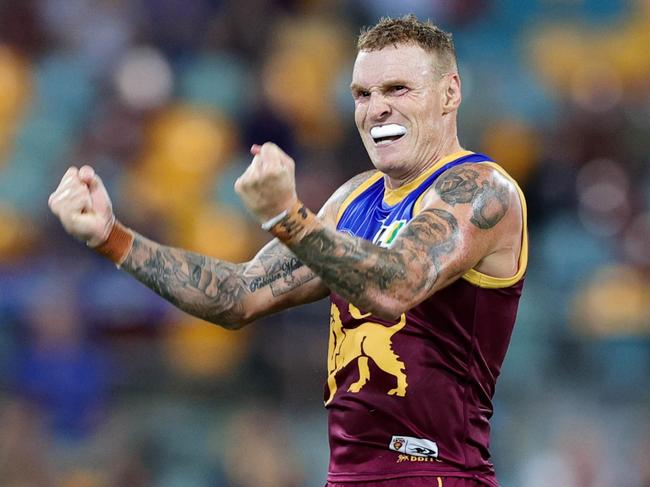 BRISBANE, AUSTRALIA - APRIL 02: Mitch Robinson of the Lions celebrates a goal during the 2022 AFL Round 03 match between the Brisbane Lions and the North Melbourne Kangaroos at The Gabba on April 02, 2022 In Brisbane, Australia. (Photo by Russell Freeman/AFL Photos via Getty Images)