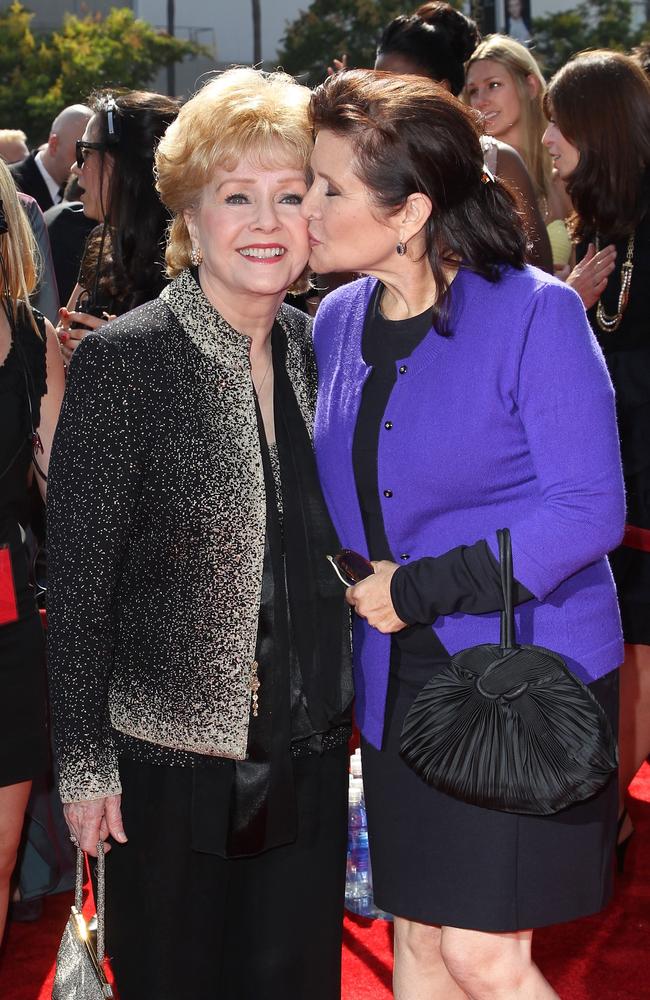 Reynolds and Fisher on the red carpet in 2011. Picture: AFP / Getty Images / Noel Vasquez