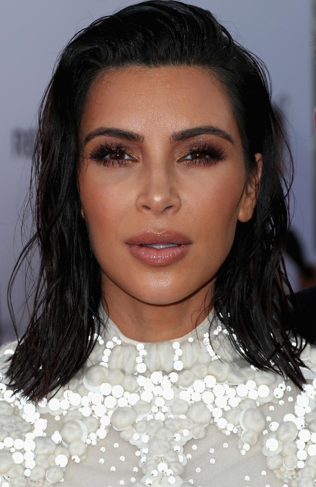 Kim Kardashian sported a natural make-up look, with dewy skin and dark eyes, at the Daily Front Row awards. Picture: Getty Images