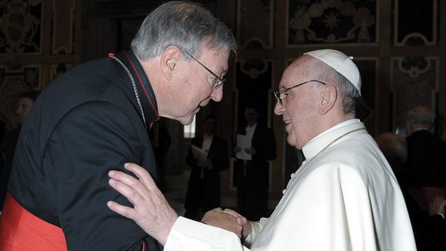 Cardinal George Pell meets with Pope Francis in 2013.