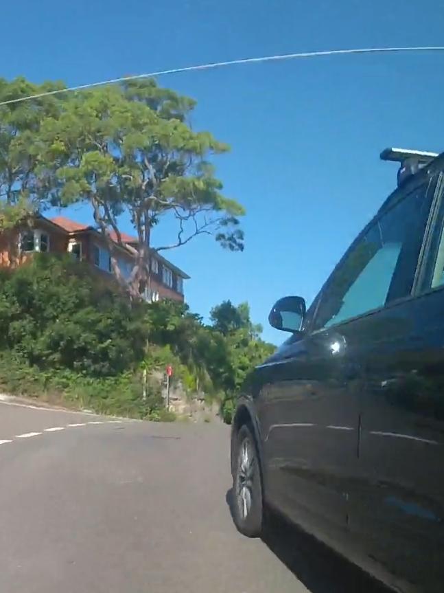 Dashcam footage of a close call on a Sydney road.