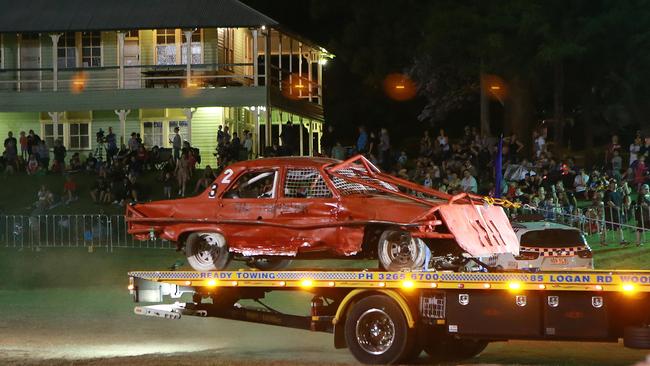 A stunt car is taken away after it rolled through barriers and into the crowd injuring people at a monster truck show at the Mount Gravatt Showgrounds in 2018. Picture: AAP/Sarah Marshall