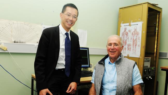 Westmead Hospital movement disorders unit director at the Department of Neurology's Dr Victor Fung with patient Philip Webster.