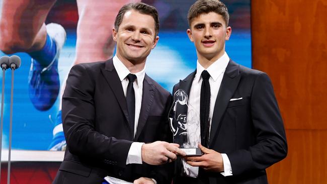 Patrick Dangerfield presents Harry Sheezel with the AFLPA Best First Year Player Award. Photo by Dylan Burns/AFL Photos via Getty Images.