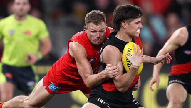 MELBOURNE, AUGUST 10, 2024: 2024 AFL Football - Round 22 - Essendon Bombers V Gold Coast Suns at Marvel Stadium. Sam Durham of the Bombers under pressure. Picture: Mark Stewart