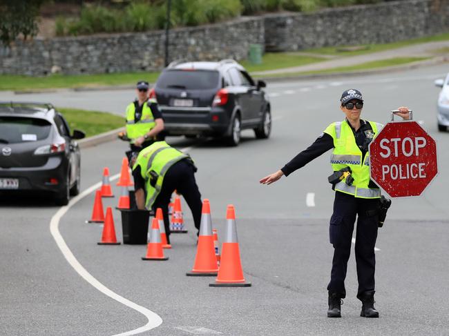 Coomera Police which are part of the Northern Patrols Group,  direct traffic to stop and pull over for a Random Breath Test on Rose Valley Drive Upper Coomera.                              Photo Scott Powick Newscorp