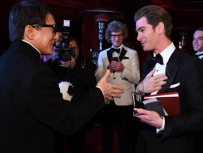 Andrew Garfield and Jackie Chan hang out at the Governors Ball. Picture: AFP/Angela Weiss