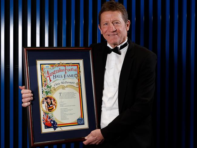 Chris McDermott holds his Australian Football Hall of Fame certificate. Picture: Getty Images