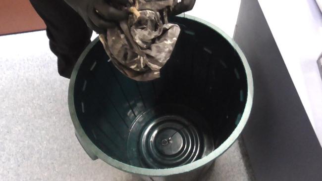 Officers quickly seize the bag.
