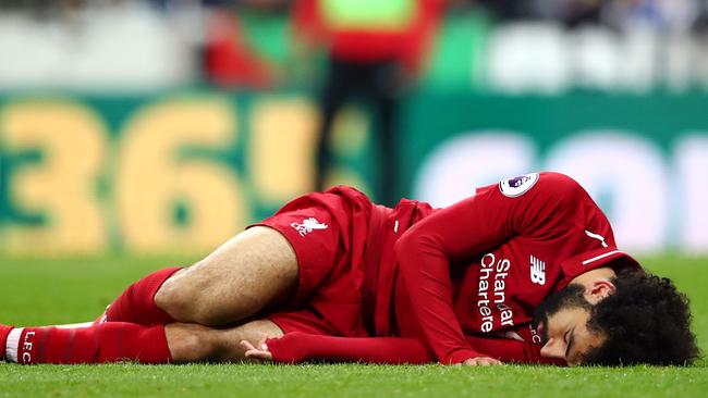 NEWCASTLE UPON TYNE, ENGLAND - MAY 04: Mohamed Salah of Liverpool goes down injured during the Premier League match between Newcastle United and Liverpool FC at St. James Park on May 04, 2019 in Newcastle upon Tyne, United Kingdom. (Photo by Clive Brunskill/Getty Images)