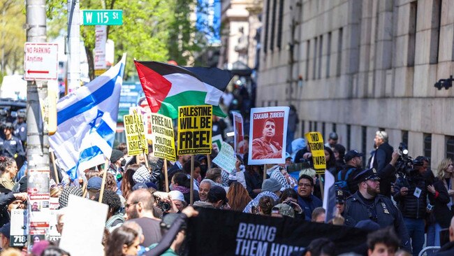 Pro-Palestine and pro-Israel protesters face off in front of the entrance of Columbia University which is occupied by pro-Palestine protesters in New York. Picture: AFP