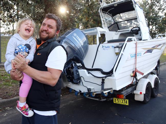 Ryan Bellingham, 39, with daughter Zara, 3, is fighting a council proposal forcing him to move his $42,000 boat and trailer every 28 days. Picture: Sam Ruttyn.