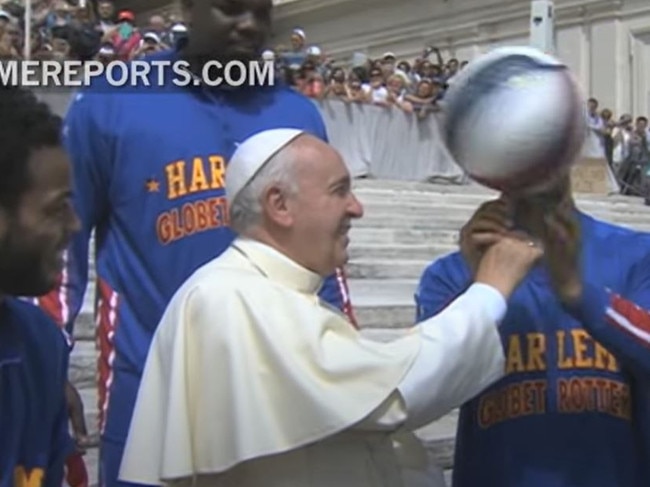The Pope spinning a basketball with the Harlem Globetrotters. The Pope was recognised as an honorary member when they took their show to Rome in 2015. He was gifted a No. 90 jersey with “Pope Francis” on the back.