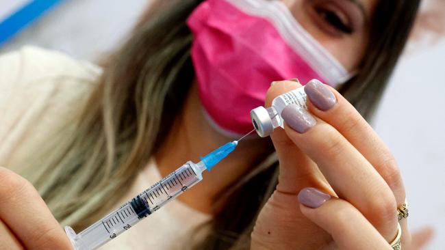 An Israeli health worker administers a dose of the Pfizer-BioNtech Covid-19 vaccine. Picture: Jack Guez/AFP