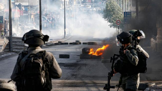 Israeli troops take position during confrontations with Palestinian protesters in the occupied West Bank city of Bethlehem.