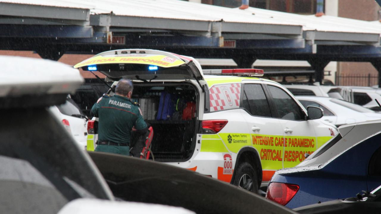 A paramedic outside Coles in Alice Springs. A man has died inside Alice Springs Coles on May 27, 2025, with police saying he was in custody at the time. Picture: Gera Kazakov