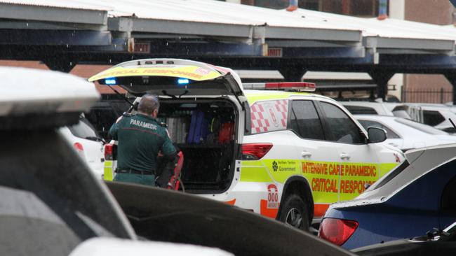 A paramedic outside Coles in Alice Springs. A man has died inside Alice Springs Coles on May 27, 2025, with police saying he was in custody at the time. Picture: Gera Kazakov
