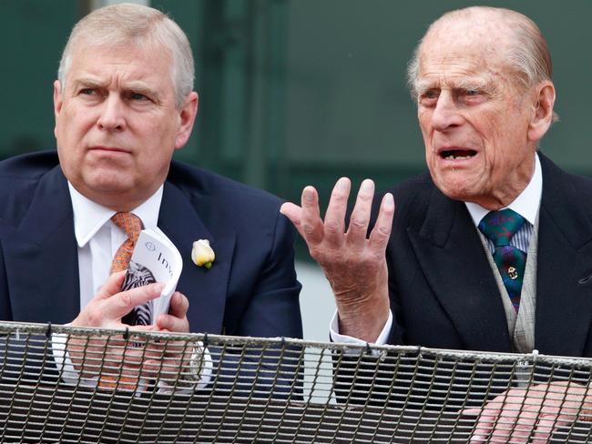 EPSOM, UNITED KINGDOM - JUNE 04: (EMBARGOED FOR PUBLICATION IN UK NEWSPAPERS UNTIL 48 HOURS AFTER CREATE DATE AND TIME) Prince Philip, Duke of Edinburgh and Prince Andrew, Duke of York watch the racing from the balcony of the Royal Box as they attend Derby Day during the Investec Derby Festival at Epsom Racecourse on June 4, 2016 in Epsom, England. (Photo by Max Mumby/Indigo/Getty Images)