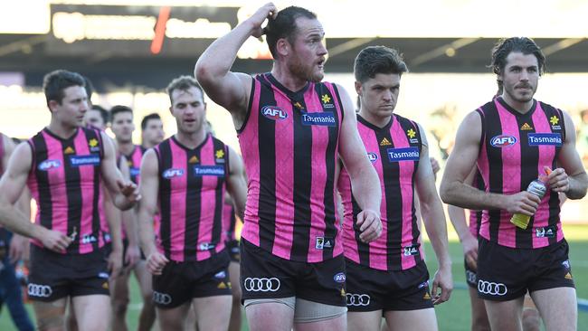 Jarryd Roughhead leads his team off after losing to Brisbane.