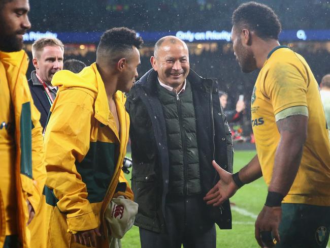 Eddie Jones mingles among the Wallabies players after the match.