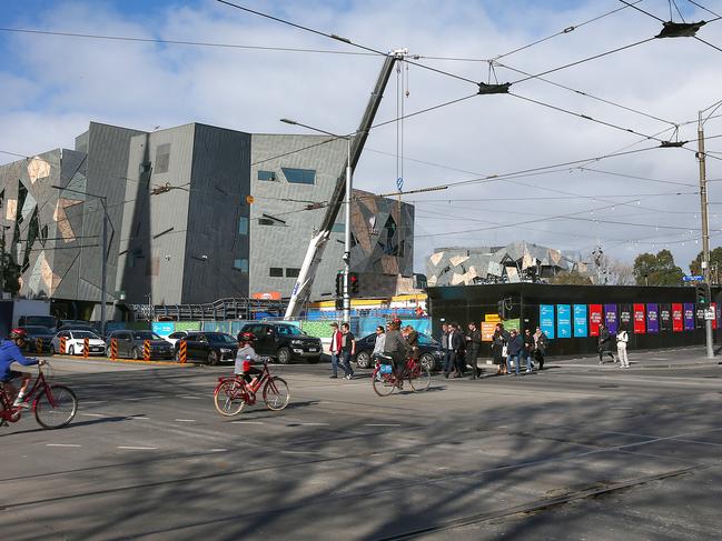 Construction has seen the city square, Federation square and surrounding sites boarded up for years turning central Melbourne into an ugly construction site. Picture: Ian Currie