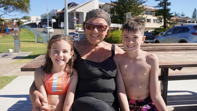 Zara Gannis, 6, Esther Gannis and Chevy Gannis, 10, at the 49th Annual Pa &amp; Ma Bendall Memorial Surfing Contest held at Moffat Beach in Caloundra on April 8, 2023. Picture: Katrina Lezaic