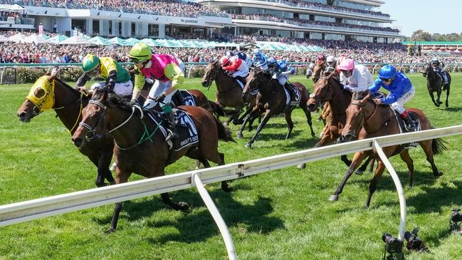 McEvoy in the pink helmet and white shirt only just missed out. Photo by George Sal/Racing Photos via Getty Images