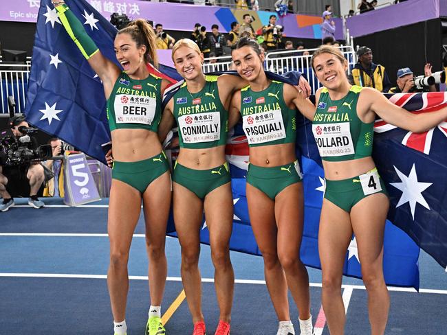 Australia's athletes (L/R): Ellie Beer, Ella Connolly, Bella Pasquali and Jemma Pollard celebrate their third place after the women's 4x400 relay final. Picture: Pedro Pardo/AFP