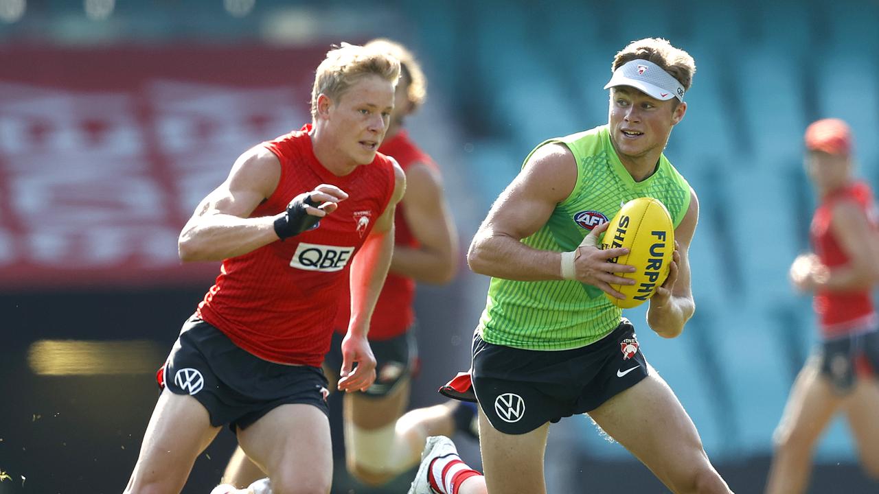 Braeden Campbell (right), with Isaac Heeney, makes his return against the Roos this weekend.