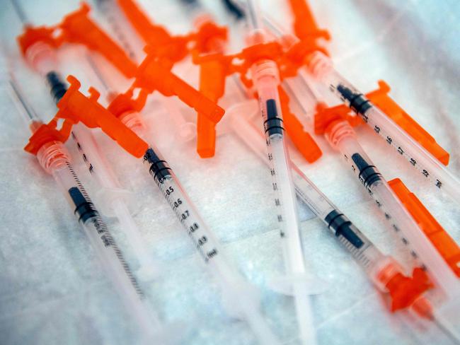 Syringes containing the Moderna Covid-19 vaccination for 6 month olds to 5 year olds lay on a table waiting to be used at Temple Beth Shalom in Needham, Massachusetts, on June 21, 2022. - US health authorities on June 18, 2022, cleared the Pfizer and Moderna Covid-19 vaccines for children aged five and younger, in a move President Joe Biden greeted as a "monumental step" in the fight against the virus. (Photo by Joseph Prezioso / AFP)