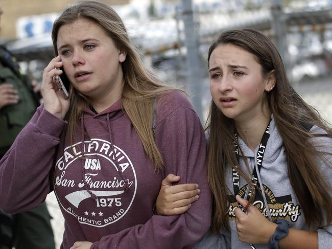 Students are escorted outside of Saugus High School after reports of a shooting. Picture: AP