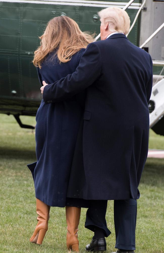 US President Donald catches First Lady Melania Trump as she trips. Picture: AFP