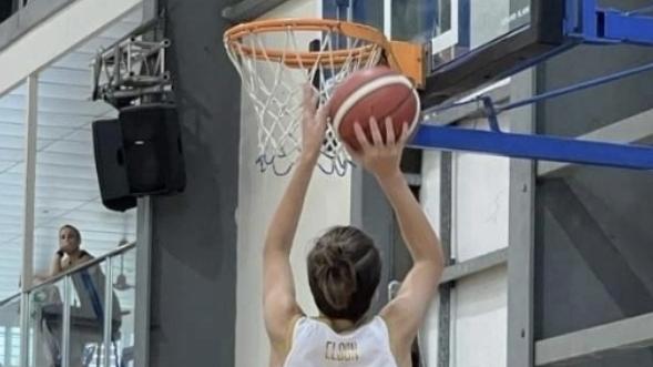 Josh Elson in action shooting a basket.