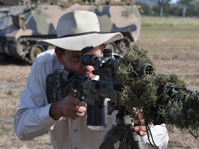 Rockhampton mayor Tony Williams with a sniper rifle at the Exercise Diamond Walk launch event.