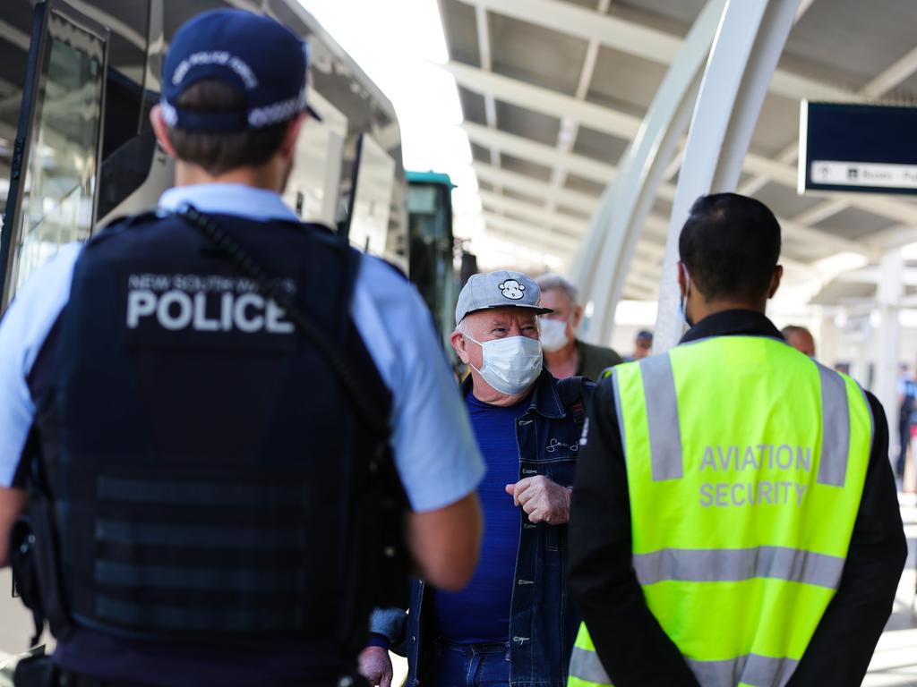 Australians arriving in Sydney are being escorted to hotel quarantine by NSW police and border officials in April. Picture: Gaye Gerard/ Daily Telegraph