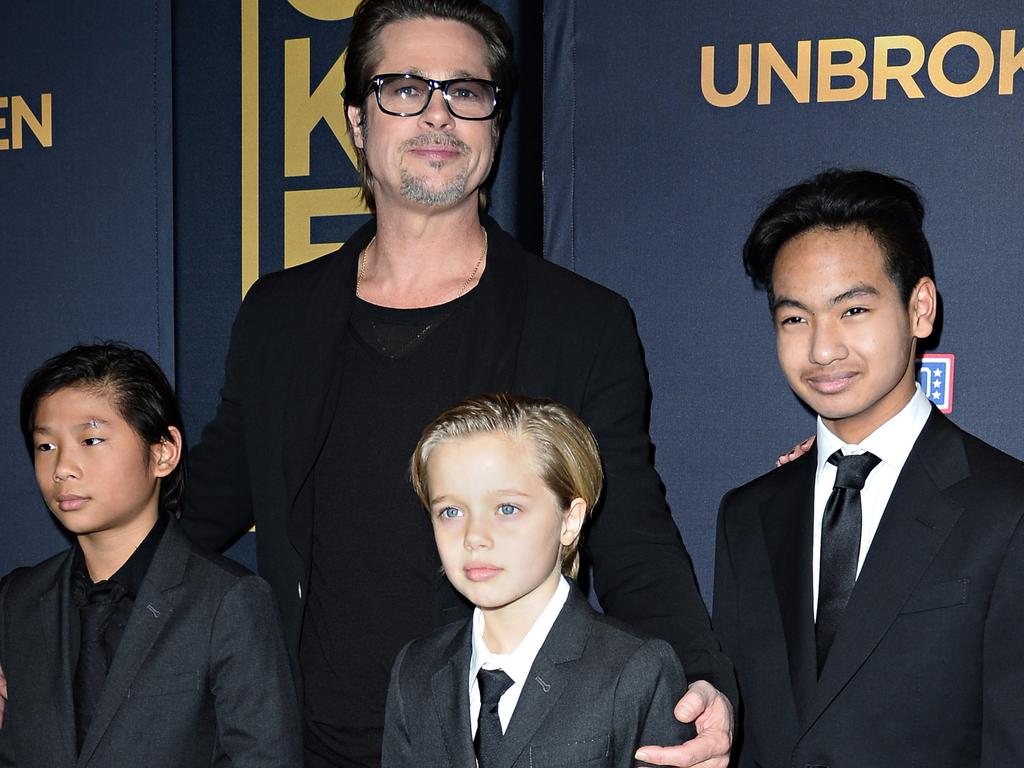 An incident on their private jet ultimately led to the Jolie-Pitt split, although Pitt was cleared of charges of hitting Maddox, far right. Picture: AFP Photo