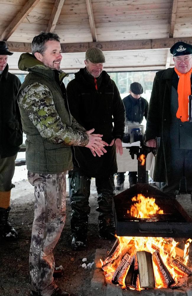 Prince Frederik warms up around a fire pit with the all-male group. Picture: @detdanskekongehus/Instagram