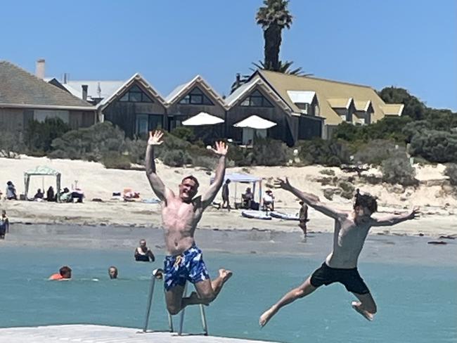 Visitors enjoy the Robe swimming pontoon, which is back in the water after insurance woes threatened to beach it for the first summer in 52 years. Lachlan Parker (left) and Oliver Knight (right)