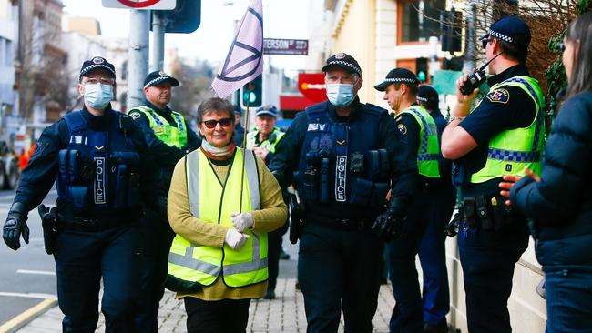 An Extinction Rebellion protester who was blocking traffic in Launceston's CBD is arrested by police on Thursday July 16, 2020. Picture: PATRICK GEE