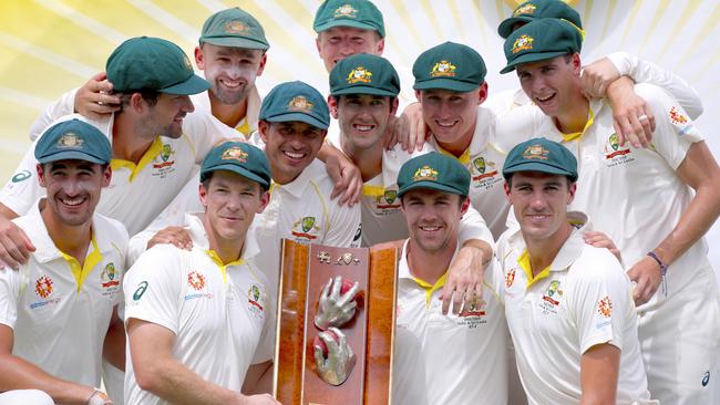 Tim Paine holds and his Australian teammates celebrate their series win against Sri Lanka at Manuka Oval in Canberra. Picture: AAP Image/David Gray