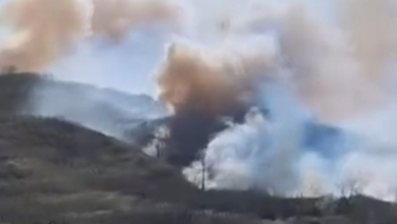 Huge plumes of smoke and flames can be seen on the eastern side of K'gari.