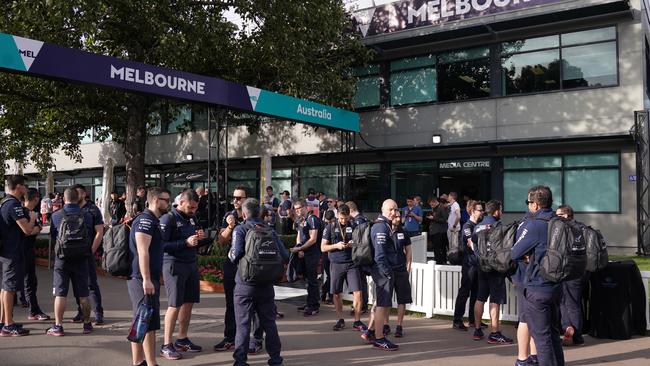 Formula One teams wait outside the entrance to the pits this morning. Picture: AAP Image/Michael Dodge