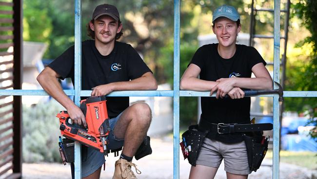 Apprentice carpenters Cate Gaskell, 18, right, and Jedd Thompson, 20, at a construction site in Brookfield, Brisbane. Picture: Lyndon Mechielsen