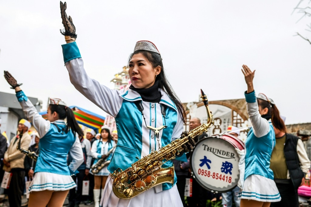 All-women marching band livens up Taiwanese funerals