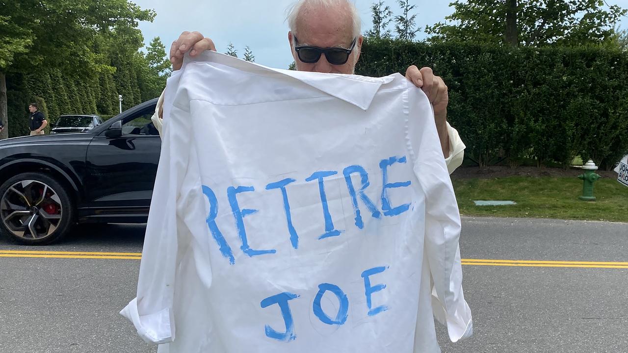 A demonstrator holds a shirt that reads "Retire Joe," outside of a fundraiser for US President Joe Biden in East Hampton, New York, US, on Saturday, June 29, 2024. Photographer: Amanda L. Gordon/Bloomberg via Getty Images