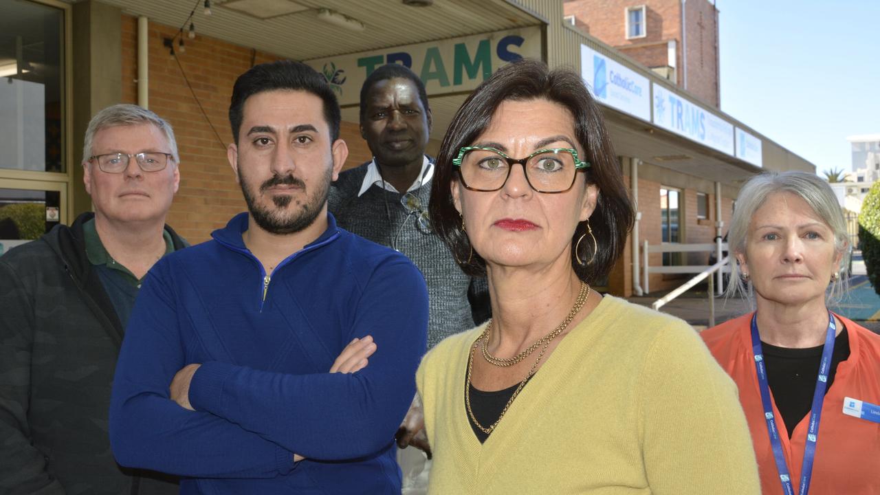 Concerned by CatholicCare's loss of funding for the Toowoomba Refugee and Migrant Support (TRAMS) service and its impacts on the city's Yazidi community are (from left) coordinator Stewart Horton, case worker-in-training Nayif Rasho, case worker Akol Mager, CatholicCare CEO Kate Venables and Diverse Queensland Workforce coordinator Linda Partridge.