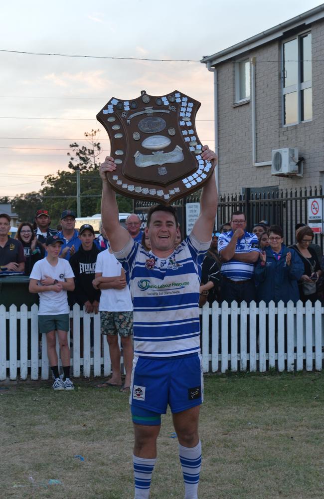 Past Brothers captain Kevin Sherriff lifts the Bundaberg Rugby League A-Grade shield.